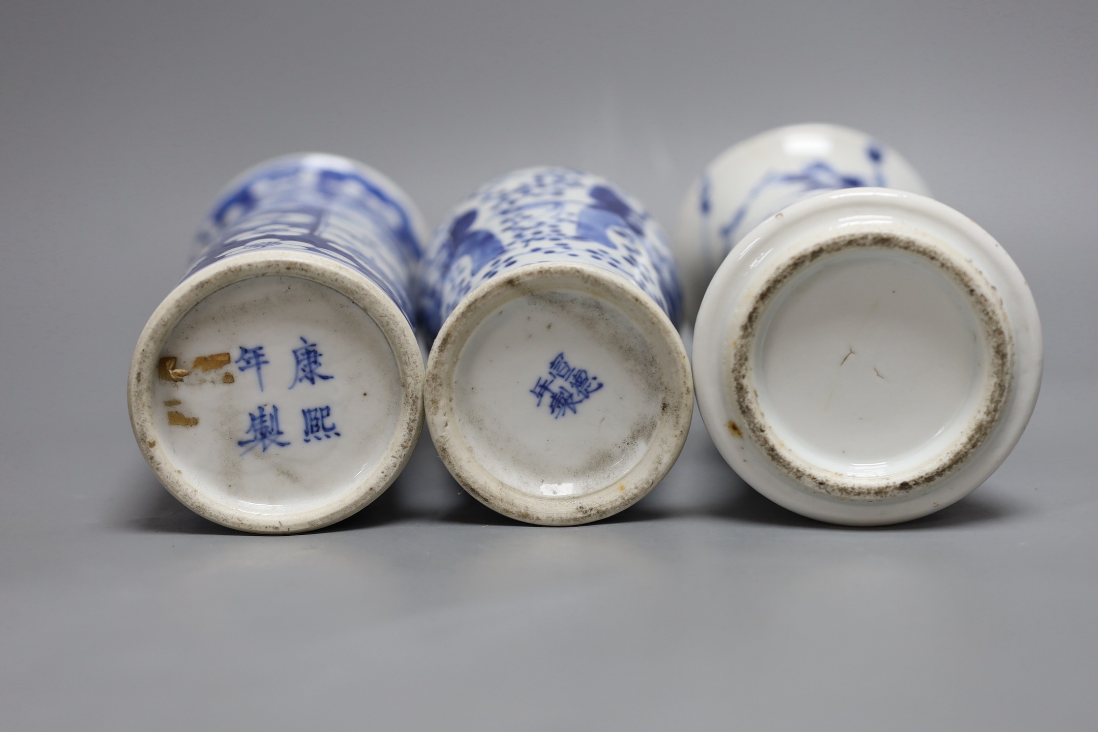 A Chinese blue and white sleeve vase and two other similar vases, late Qing dynasty, tallest 21 cms high